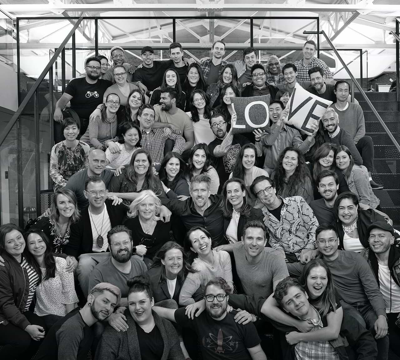 A large group of Madison Reed team members in an archival company photograph